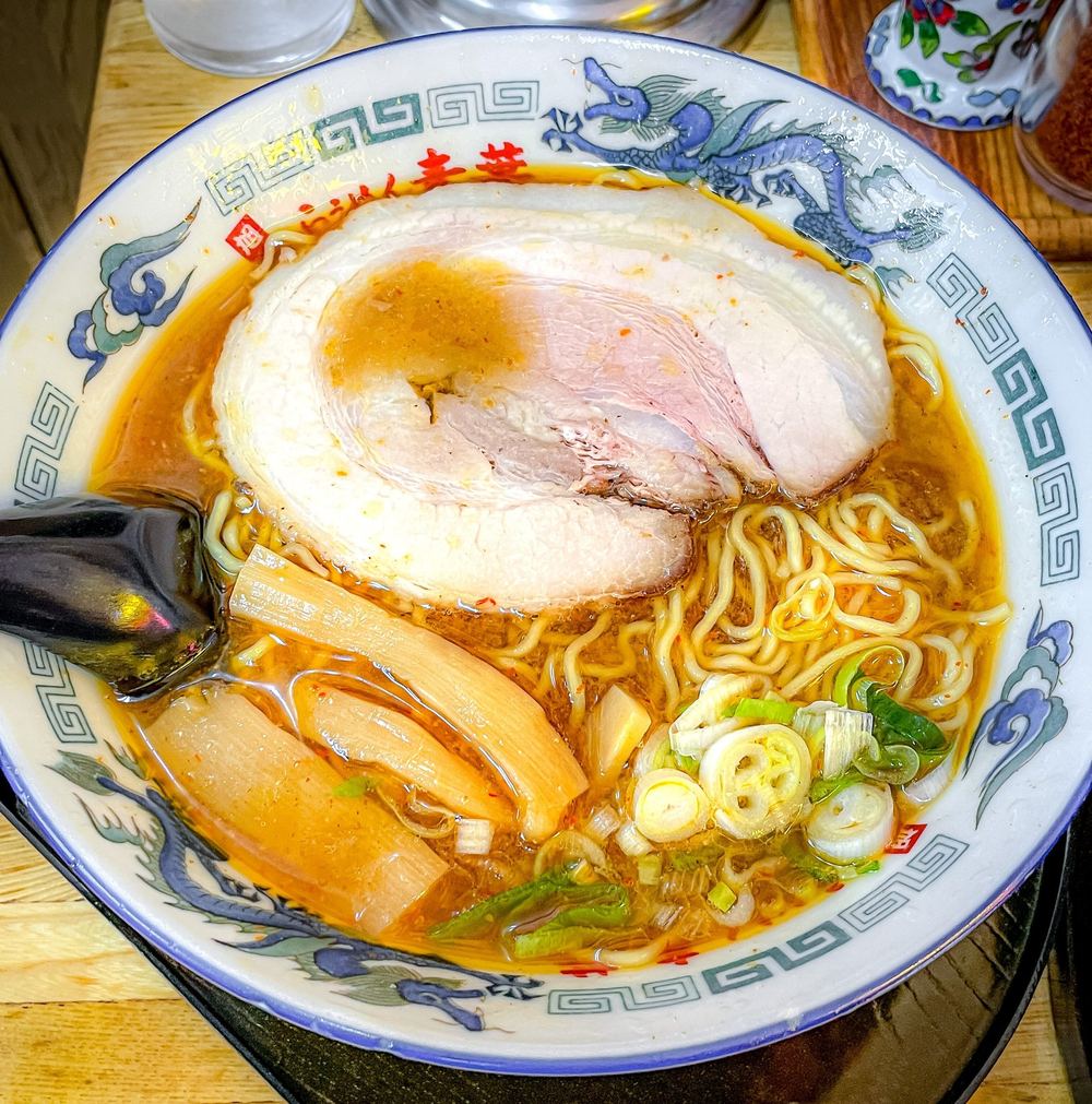 Steaming ramen bowl with chashu pork